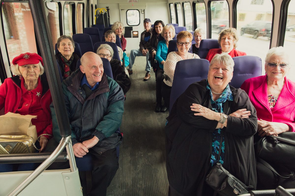 seniors on a bus going to an outing