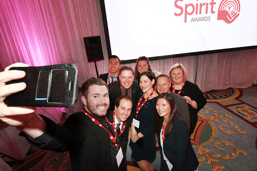 A group of Spirit Award recipients taking a selfie together.