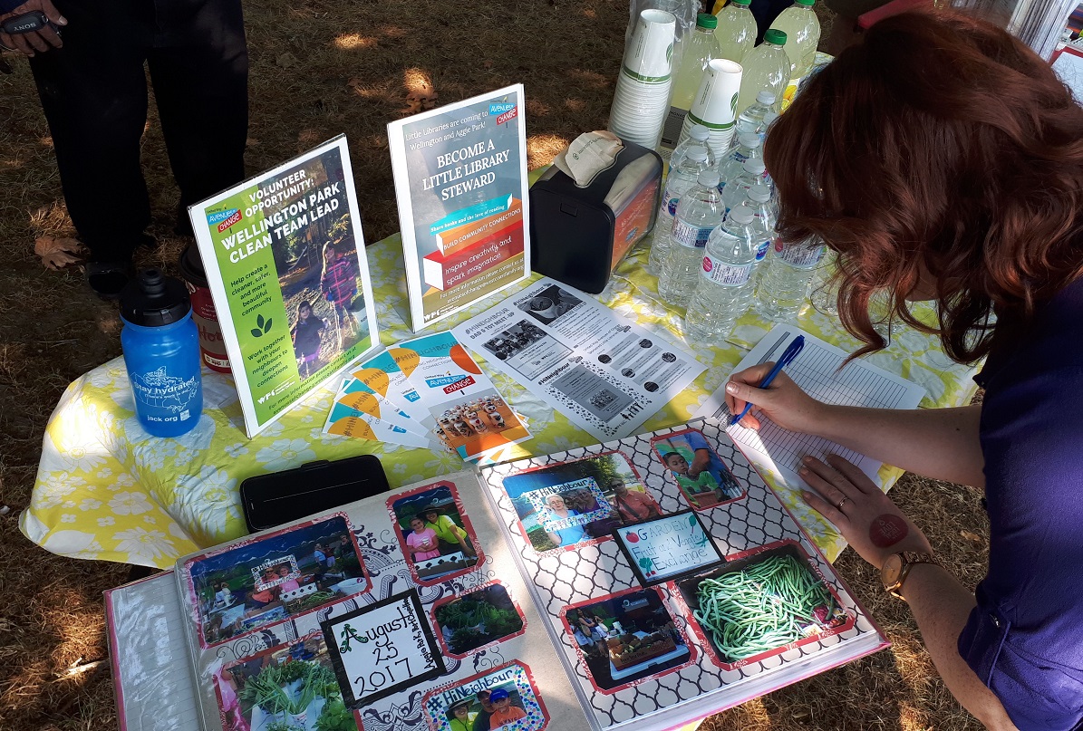 A scrapbook and pamphlets on a table.