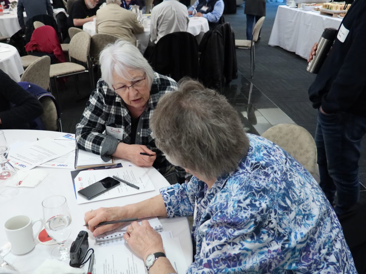 seniors talking at table