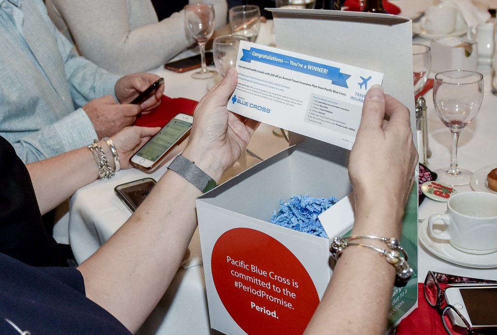 woman gets pacific blue cross voucher